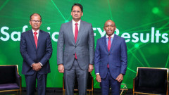 Safaricom PLC Chairman, Adil Khawaja (centre) with Safaricom PLC Chief Executive Officer (CEO), Peter Ndegwa and Safaricom PLC Chief Finance Officer, Dilip Pal. PHOTO/COURTESY